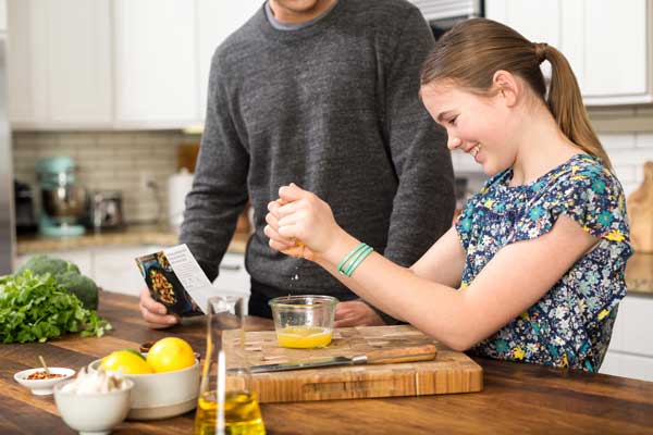 daughter cooking with father